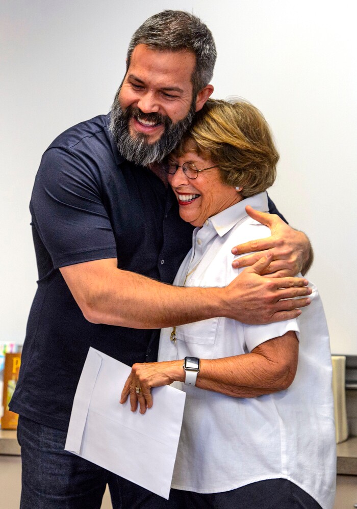 (Steve Griffin  |  The Salt Lake Tribune)  Franklin Elementary School special education teacher Jason Adam Tackett hugs Karen Huntsman, after she made the surprise announcement  that he has won the Huntsman Award for Excellence in Education, during the school's faculty meeting in Salt Lake City Monday April 23, 2018. With the award comes a $10,000 cash prize.
