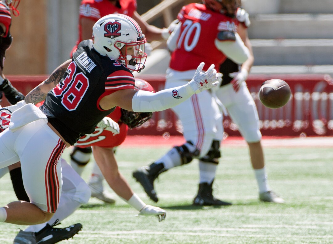 (Ed Kosmicki | Special to The Tribune) The black team safety Stone Azarcon #38 can't quite find the handle on a brocken up pass during the annual spring football game at the University of Utah, 17 April 2021.