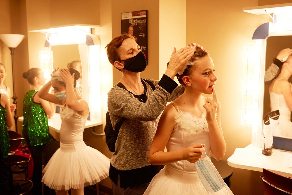 (Shawn Poynter | The New York Times) Dancers prepare to perform for a limited live crowd at the Tennessee Theatre in Knoxville, Tenn. on May 8, 2021. With safety restrictions easing, Americans from Maine to Montana are returning to concert halls, worship services and soapbox derbies in all 50 states.