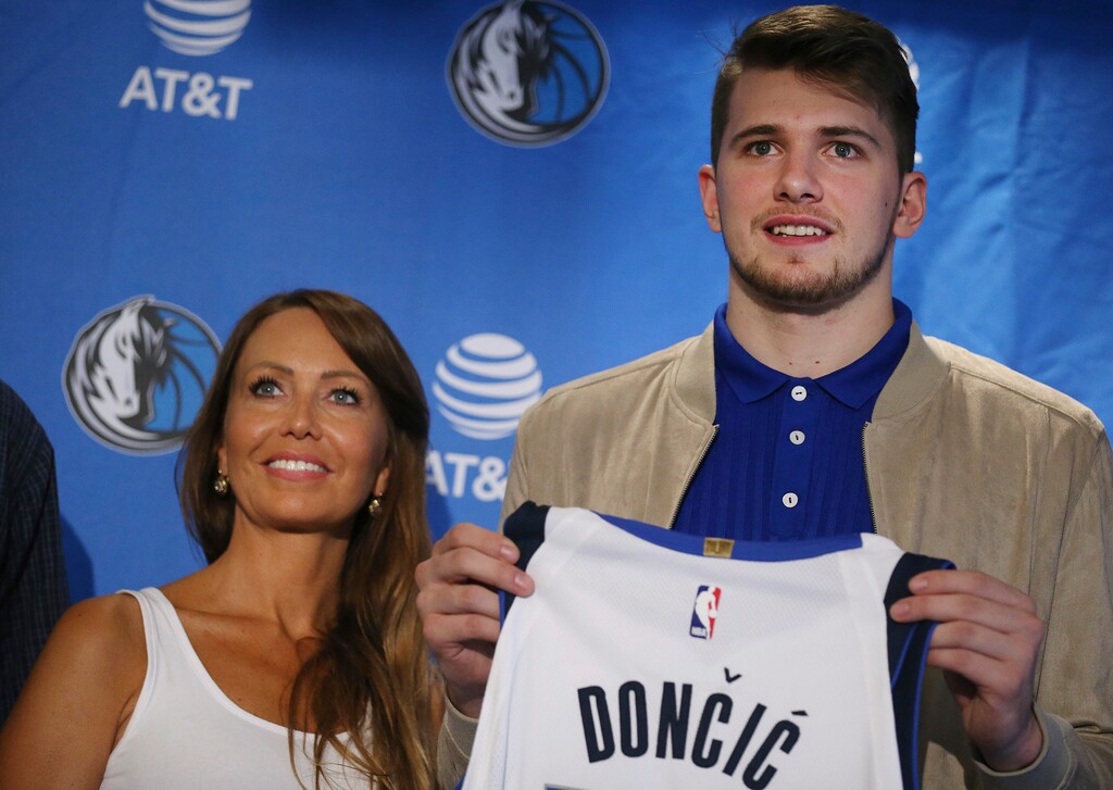 Mirjam Poterbin stands with her son Luka Doncic after he was introduced to reporters by the Dallas Mavericks in Dallas on Friday, June 22, 2018, the day after the first two rounds of the NBA draft. (Andy Jacobsohn/The Dallas Morning News via AP)