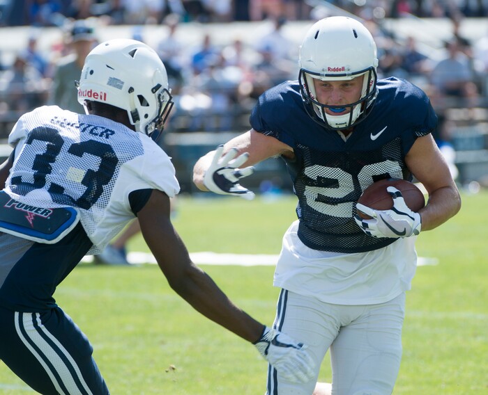 (Rick Egan  |  The Salt Lake Tribune) Rickey Shumway runs the ball, as 	Beau Tanner defends, during  a BYU public scrimmage at Lavell Edwards Stadium, Thursday, August 17, 2017.