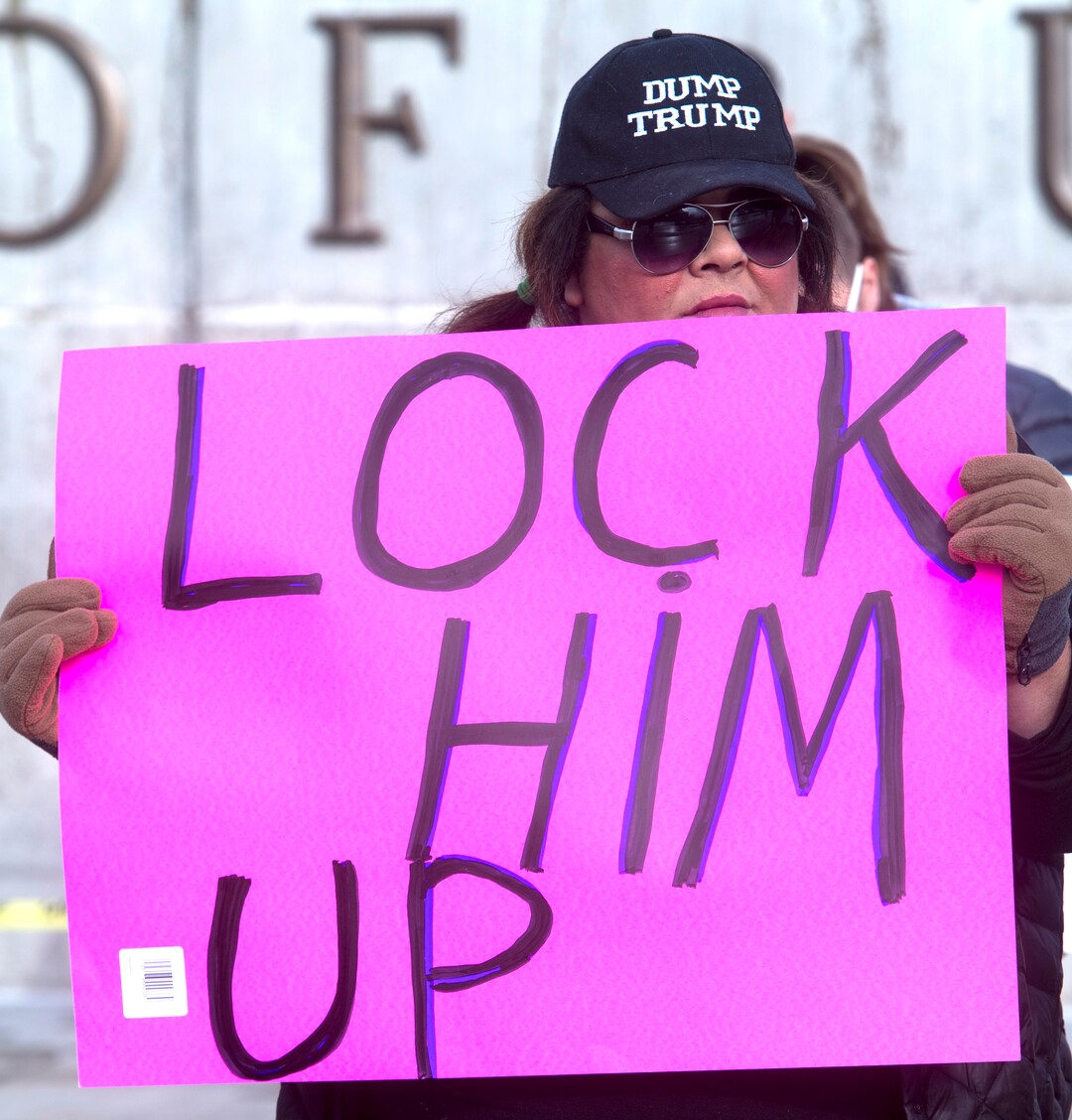 (Rick Egan  |  The Salt Lake Tribune) Kourtney Moore, of Salt Lake City protests President Trump's visit to Utah to shrink the Bears Ears monument in front of the Utah State Capitol Building, Monday, December 4, 2017.