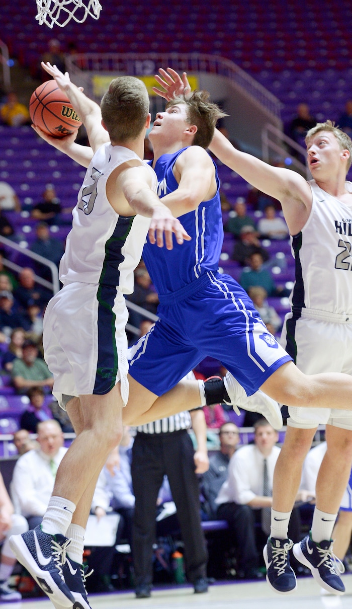 (Leah Hogsten  |  The Salt Lake Tribune) Copper Hills' Bryan Holgate (25) tries to stop Bingham's Dalton Miller (11). Copper Hills faces Bingham in the 6A High School Boys' Basketball Tournament opening game at Weber State University’s Dee Events Center in Ogden, Tuesday, Feb. 27, 2018. 