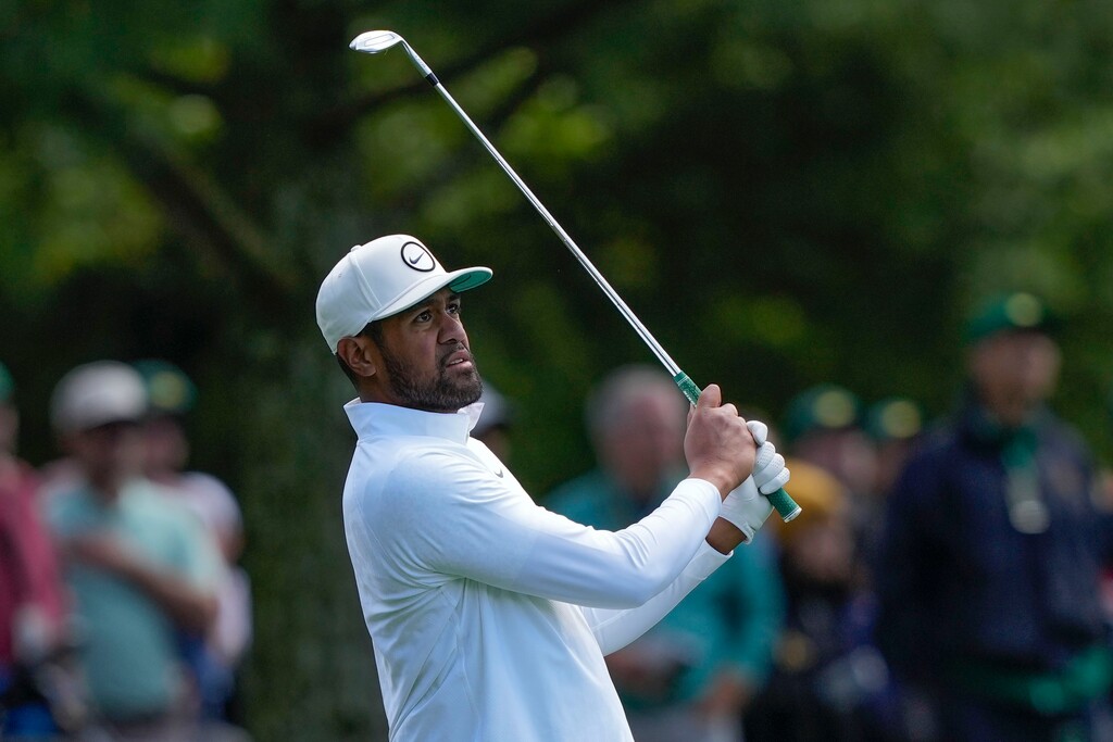 Tony Finau hits from the fairway on the eighth hole during the final round of the Masters golf tournament at Augusta National Golf Club on Sunday, April 9, 2023, in Augusta, Ga. (AP Photo/David J. Phillip)