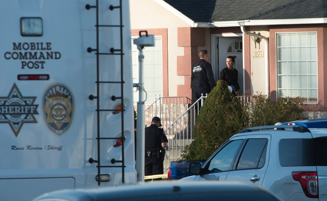 (Rick Egan  |  The Salt Lake Tribune)     Investigators from West Valley and Unified Police investigate an officer involved  shooting, leaving the suspect dead, in West Valley City, Sunday, April 8, 2018.