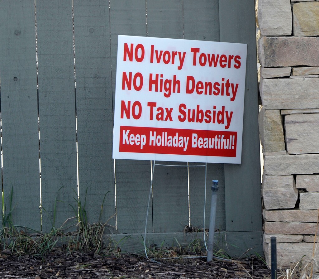 (Al Hartmann  |  The Salt Lake Tribune) 	Signs in the front yards of homeowners in the area of the old Cottonwood Mall site near 4800 S. Highland Drive in Holladay on Tuesday March 13, 2018.  