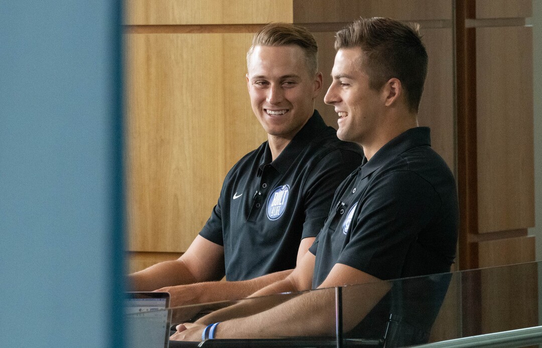 (Francisco Kjolseth | The Salt Lake Tribune) Brothers Baylor Romney, left, and Gunner argue over the details of family stories being competitive with one another as they join BYU football coaches, players and staff participating in BYU Football Media Day in the BYU Broadcasting Building in Provo on Thursday, June 17, 2021.