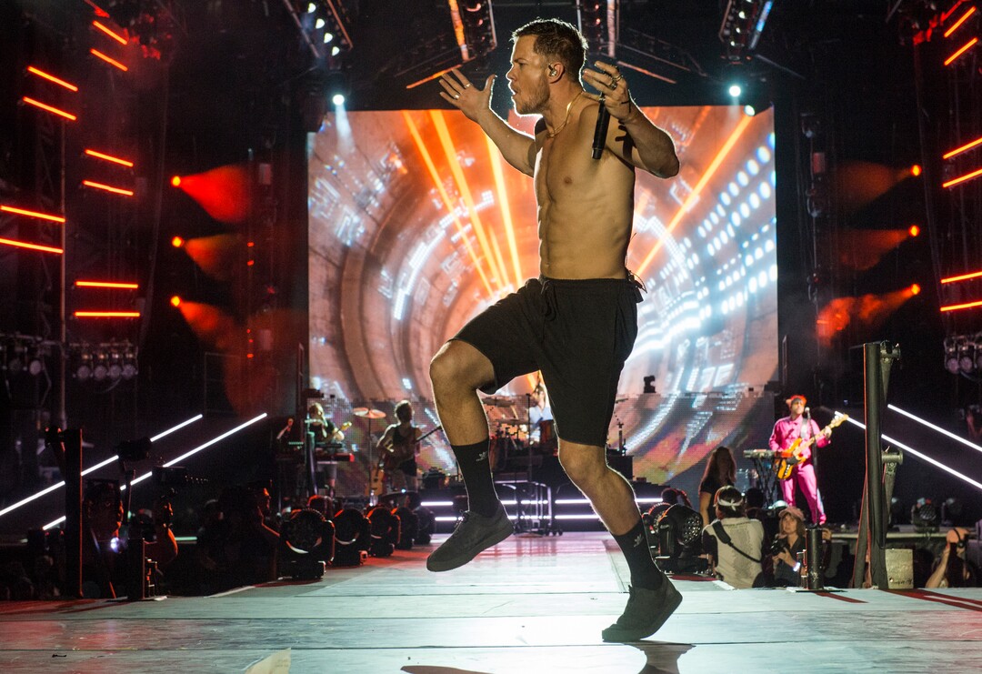 (Rick Egan  |  The Salt Lake Tribune)     Dan Reynolds performs with Imagine Dragons at the Loveloud Festival at Rice-Eccles Stadium, Saturday, July 28, 2018.