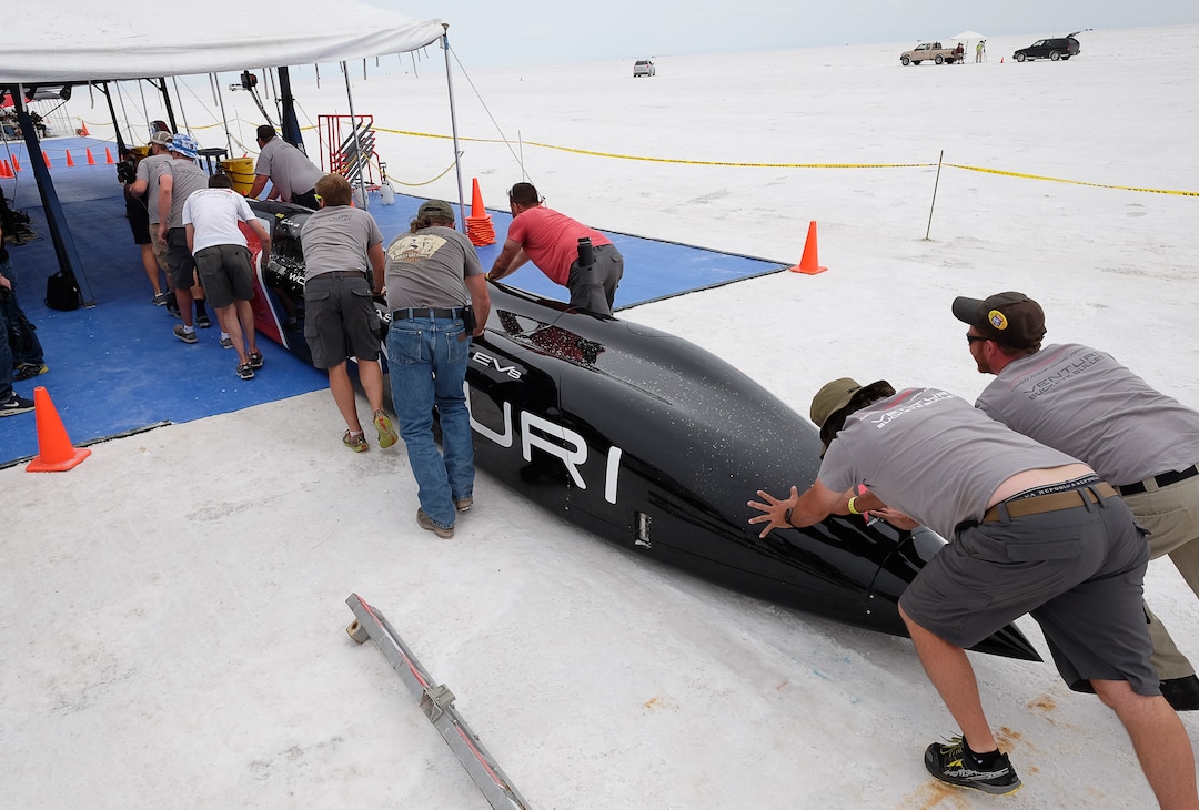 (Francisco Kjolseth  | Tribune file photo)  The pit crew pushes the all electric Venturi vehicle from Ohio State University back to the pit after a run during Speed Week at the Bonneville Salt Flats outside Wendover on Monday, Aug. 14, 2017.