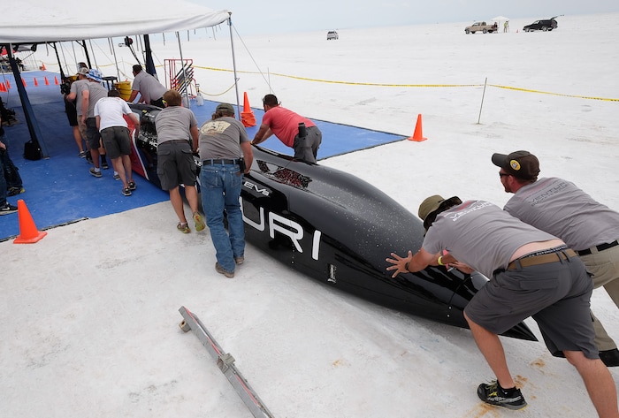 (Francisco Kjolseth  |  The Salt Lake Tribune)  The pit crew pushes the all electric Venturi vehicle from Ohio State University back to the pit after a run during Speed Week at the Bonneville Salt Flats outside Wendover on Monday, Aug. 14, 2017.