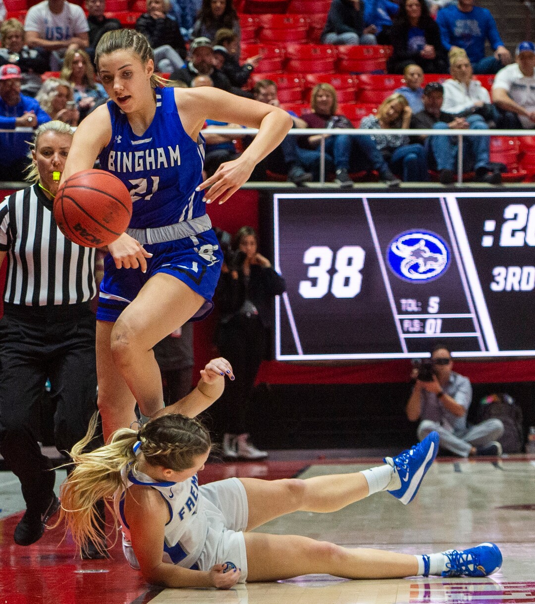 (Rick Egan  |  The Salt Lake Tribune)   Bingham Miners Chloe Daniels  (21)  tries to save the ball as she collides with Fremont Sliverwolves Daycee Townsend (14),  in the 6A championship game, between the Fremont Sliverwolves and the Bingham Miners, at the Jon M. Huntsman Center, Saturday Feb. 29, 2020
