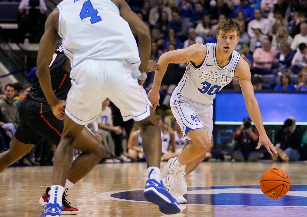 (Bethany Baker  |  The Salt Lake Tribune) Brigham Young Cougars guard Dallin Hall (30) dribbles during the game against the Houston Cougars in Provo on Tuesday, Jan. 23, 2024.