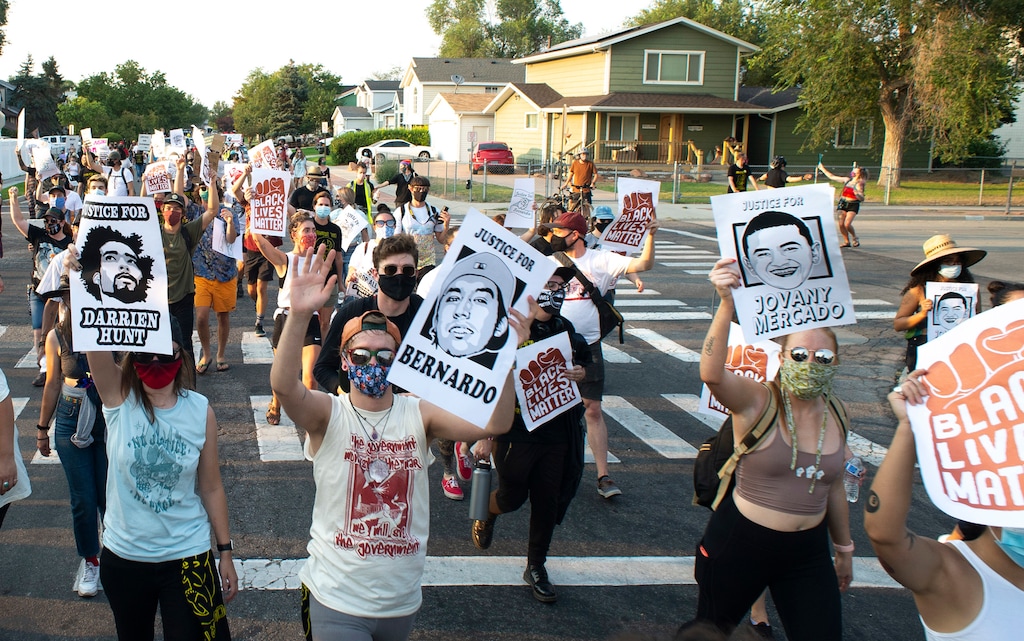 (Rick Egan  |  The Salt Lake Tribune)     Protesters dance through the neighborhood in Rose Park, during the Dance Dance for Revolution protest for racial equality, on Sunday, Aug. 23, 2020. The protest was in memory of Jovany Mercardo who was shot last August by Ogden police by four officers, hitting his body sixteen times.
