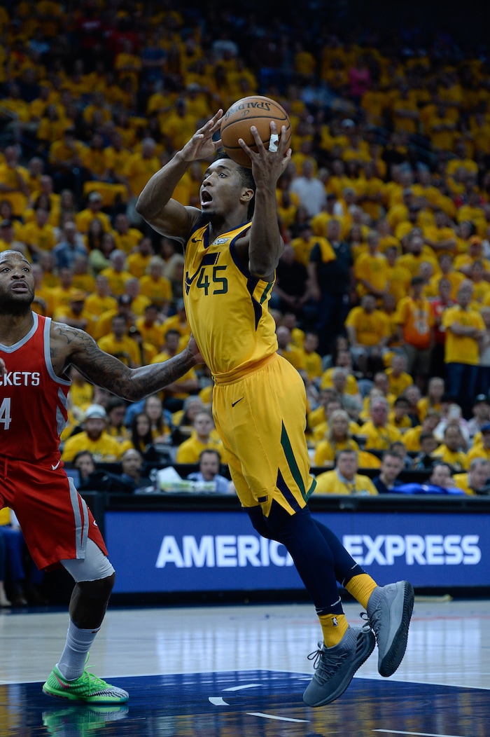 (Francisco Kjolseth | The Salt Lake Tribune) Utah Jazz guard Donovan Mitchell (45) drives the ball past the Houston Rockets in Game 4 of the NBA playoffs at the Vivint Smart Home Arena Sunday, May 6, 2018 in Salt Lake City.