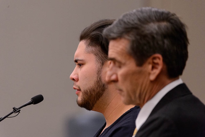 (Trent Nelson | The Salt Lake Tribune)  Abraham Miranda listens to his sentence in court in Salt Lake City, Thursday December 21, 2017. Miranda, 19, pleaded guilty to manslaughter counts for a February crash that killed two of his West High School classmates and critically injured a pregnant woman and her baby. At right is his attorney, Greg Skordas.