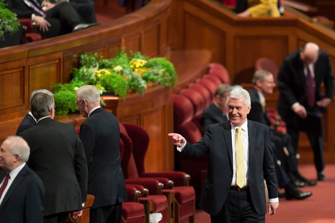 (Jeremy Harmon  |  The Salt Lake Tribune)  Elder Dieter F. Uchtdorf greets other General Authorities at the start of the Sunday afternoon session of General Conference on April 1, 2018.