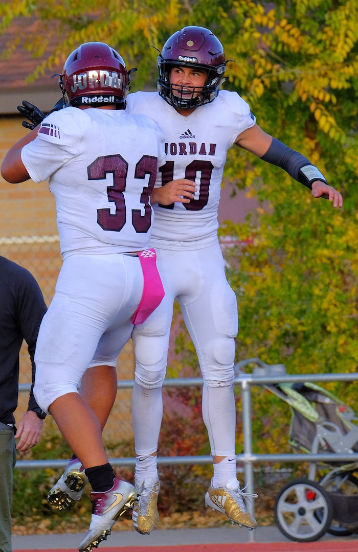 (Leah Hogsten  |  The Salt Lake Tribune) Jordan's Soni Vunipola celebrates quarterback Crew Wakeley's touchdown.  Jordan High School boys' football team leads Viewmont High School 14-10 at the half during their class 5A football playoff opener, Friday, October 27, 2017 in Bountiful