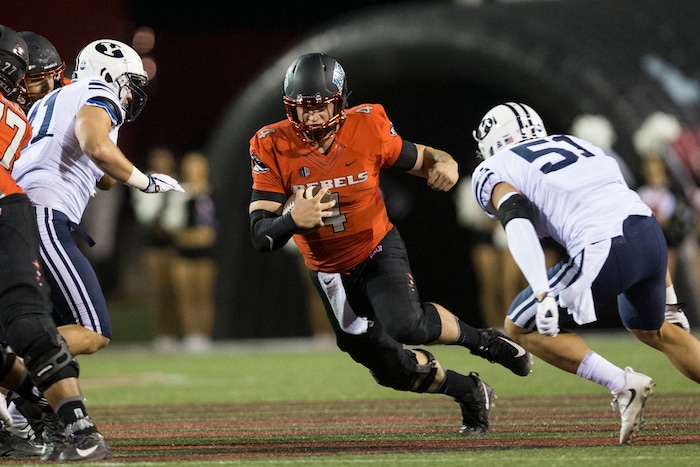 UNLV quarterback Johnny Stanton (4) carries against BYU during an NCAA college football game Friday, Nov. 10, 2017, in Las Vegas. (Erik Verduzco/Las Vegas Review-Journal via AP)