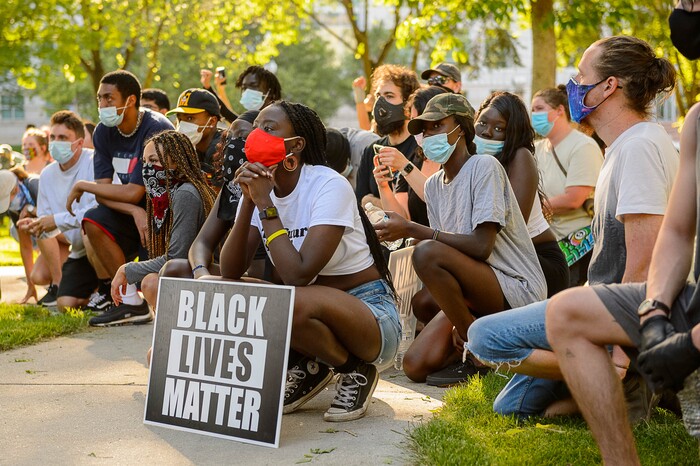 (Trent Nelson  |  The Salt Lake Tribune) People kneel as the names of people killed by police are read during a protest against police brutality in Salt Lake City on Monday, June 1, 2020.