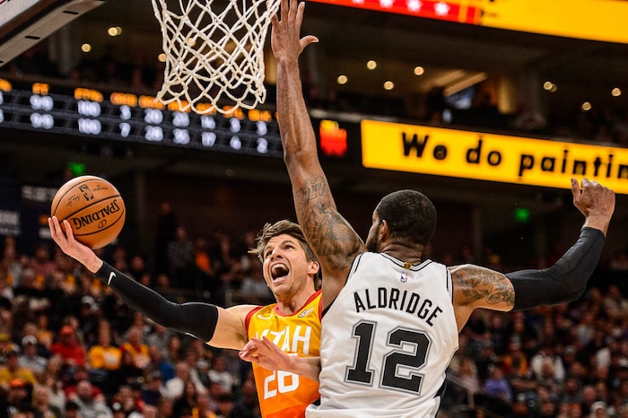 (Trent Nelson | The Salt Lake Tribune)  
Utah Jazz guard Kyle Korver (26) shoots around San Antonio Spurs center LaMarcus Aldridge (12) as the Utah Jazz host the San Antonio Spurs, NBA basketball in Salt Lake City on Saturday Feb. 9, 2019.