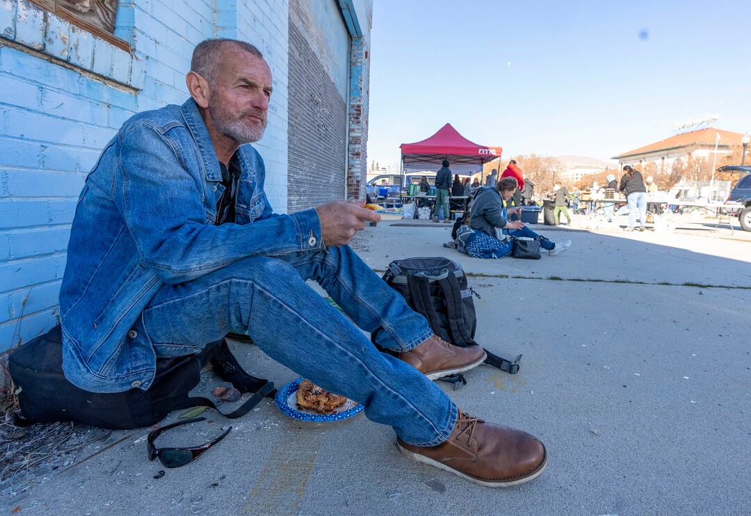 (Rick Egan | The Salt Lake Tribune) Kim Moody enjoys his  Navajo Taco, during a "Gratitude Dinner" served by volunteers from the group Black Lives for Humanity, on 500 West in Salt Lake City, on Thursday, Nov. 25, 2021. The group served   to more than 100 people from the unsheltered population, with donations from the community.
