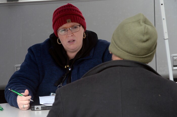 (Al Hartmann  |  The Salt Lake Tribune) 	
Meisha Jensen, a social woker with the Veterans Administration, interviews a homeless veteran at a mobile outreach center near the rock quarry above Victory Road, on Thursday Feb. 15, 2018.   Salt Lake City Police, Volunteers of America, Utah Highway Patrol, and social workers from Salt Lake City and the Veterans Administration set up an outreach center along Victory Road north of the state Capitol building.