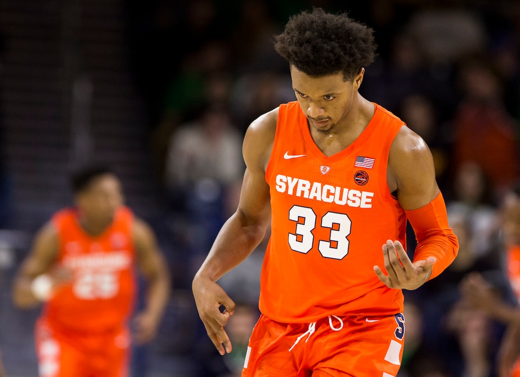 Syracuse's Elijah Hughes (33) mimics playing a guitar as he celebrates after scoring during the second half of an NCAA college basketball game against Notre Dame, Saturday, Jan. 5, 2019, in South Bend, Ind. Syracuse won 72-62. (AP Photo/Robert Franklin)