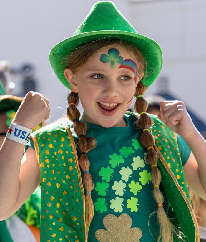 (Rick Egan | The Salt Lake Tribune) Sophie Chase dances as she watches the St. Patrick's Parade at the Gateway in Salt Lake City, on Saturday, March 12, 2022.