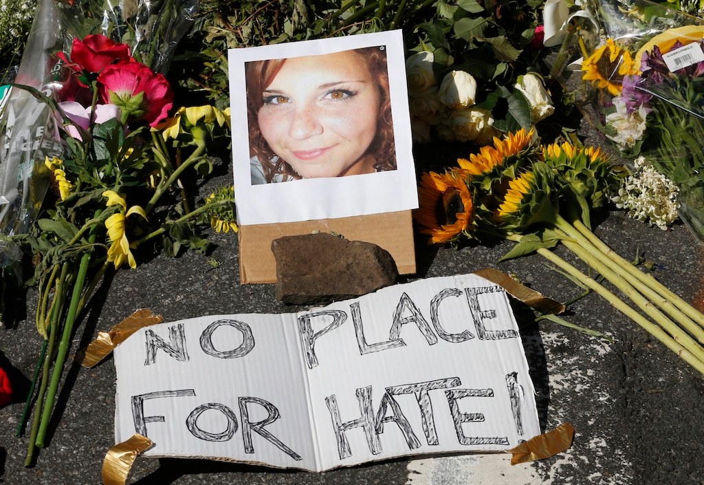 (Steven Helber  |  AP Photo)  A makeshift memorial of flowers and a photo of victim, Heather Heyer, sits in Charlottesville, Va., Sunday, Aug. 13, 2017. Heyer died when a car rammed into a group of people who were protesting the presence of white supremacists who had gathered in the city for a rally.