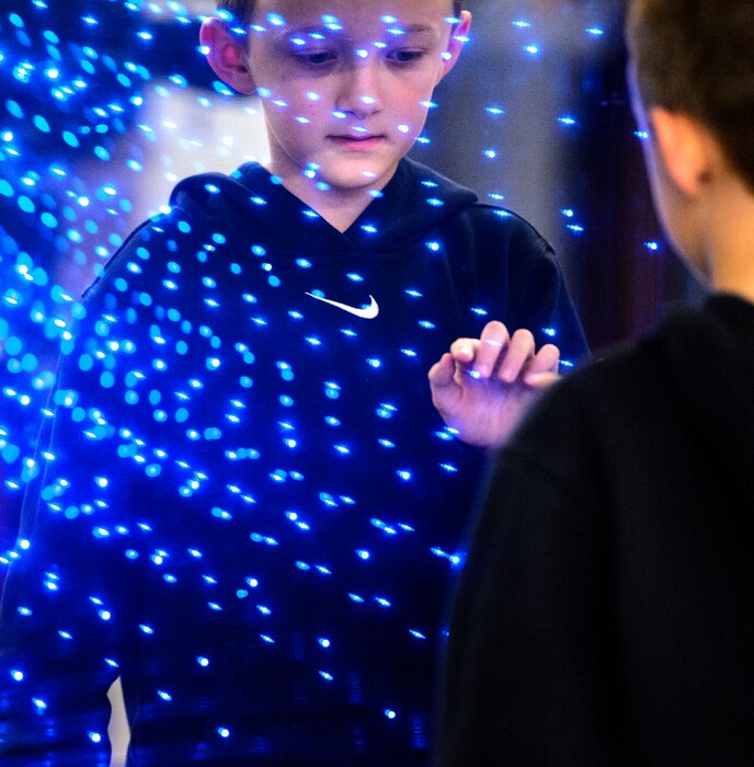 (Steve Griffin  |  The Salt Lake Tribune)  Jackson Pratt, age 9, enjoys a light display in the new Sensory Room designed and built by Vivint Smart Home and the Utah Jazz inside the arena in Salt Lake City Wednesday March 14, 2018. The sensory room for individuals with intellectual and developmental disabilities opens to the public March 30. 