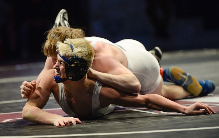 (Francisco Kjolseth  |  The Salt Lake Tribune) Oakley Ridge of Pleasant Grove battles Kegan Leatherow of Fremont in the Class 6A 120 state wrestling championship match at the Utah Valley University UCCU Center on Thursday, Feb. 8, 2018.