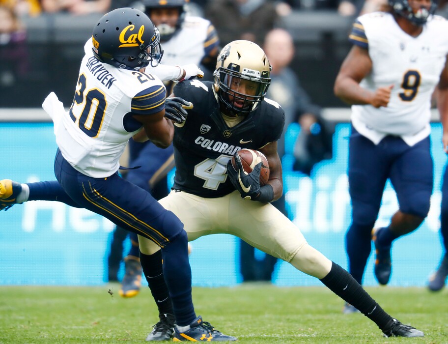 California cornerback Josh Drayden, left, tries to pull done Colorado wide receiver Bryce Bobo after he pulled in a pass in the first half of an NCAA college football game Saturday, Oct. 28, 2017, in Boulder, Colo. (AP Photo/David Zalubowski)