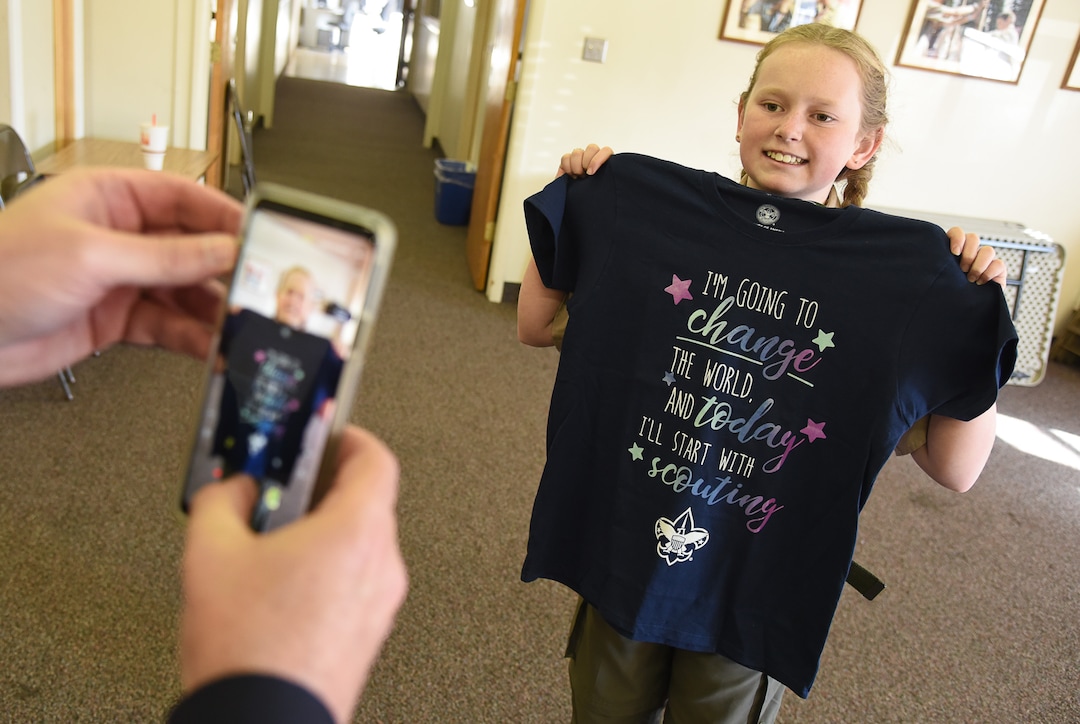 (Francisco Kjolseth  |  The Salt Lake Tribune)  Miriam Cook of Tooele shows off her new shirt which reads "I'm going to change the world, and today I'll start with scouting" after visiting the store at the Great Salt Lake Council Boys Scouts of America building in Salt Lake on Friday, Feb. 1, 2019. Cook plans to be among the first females in Utah to join the boy scouts.