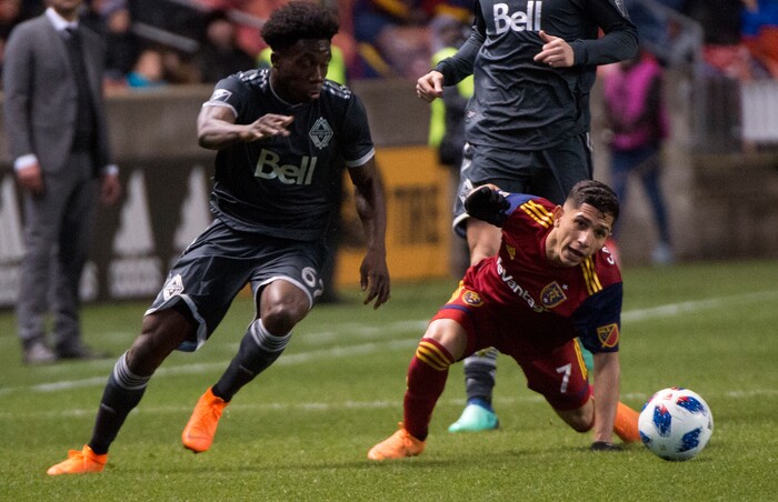 (Rick Egan  |  The Salt Lake Tribune)      Real Salt Lake forward Jefferson Savarino (7) goes for the ball along with Vancouver Whitecaps forward Alphonso Davies (67), in MLS action between Real Salt Lake and Vancouver Whitecaps, at Rio Tinto Stadium beSaturday, April 7, 2018.


