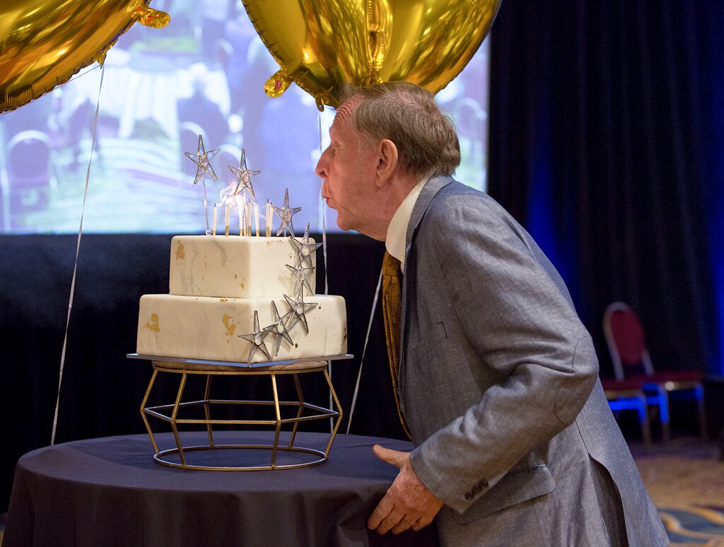 (Rebecca Reed) Historian Richard Bushman blows out the candles on his 90th birthday cake during a celebration at a Salt Lake City hotel Sept. 25, 2021.