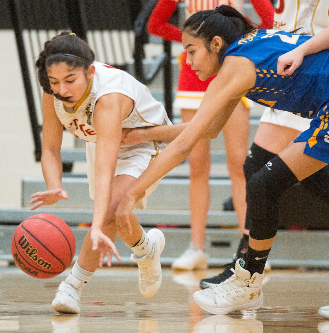 (Rick Egan  |  The Salt Lake Tribune)   Tasiah Little (21) San Juan, goes after a loose ball along with Emily Garcia (1) Judge Memorial, in 3A Women's basketball State playoff action Judge Memorial Vs. San Juan, in Heber City, Friday, Feb. 16, 2018.