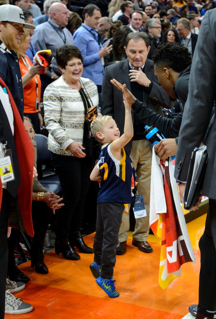 (Steve Griffin  |  The Salt Lake Tribune) A young fan gets a high five fro Utah Jazz guard Donovan Mitchell (45) after the Jazz defeated the Golden State Warriors at Vivint Smart Home Arena in Salt Lake City Tuesday January 30, 2018.