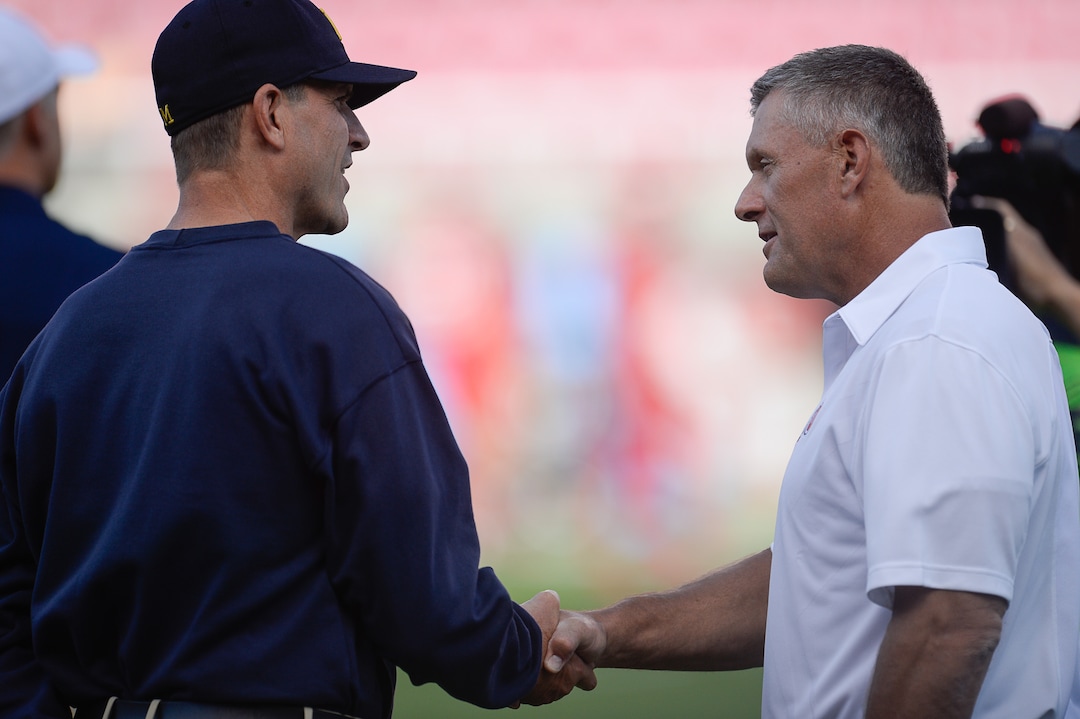 Francisco Kjolseth | The Salt Lake TribuneMichigan Wolverines coach Jim Harbaugh shakes hands with Utah coach Kyle Whittingham before the start of the game at Rice Eccles Stadium on Thursday, Sept. 3, 2015.