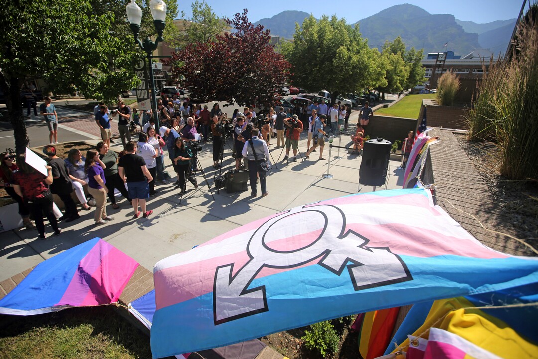People gather during a news conference to discuss the America's Freedom Festival's decision Thursday, June 14, 2018, in Provo, Utah. LGBT groups that were denied requests to participate in a July 4 parade that is part of America's Freedom Festival in Provo spoke out Thursday about being rejected even after festival organizer and Provo city officials signed nondiscrimination deal. (AP Photo/Rick Bowmer)