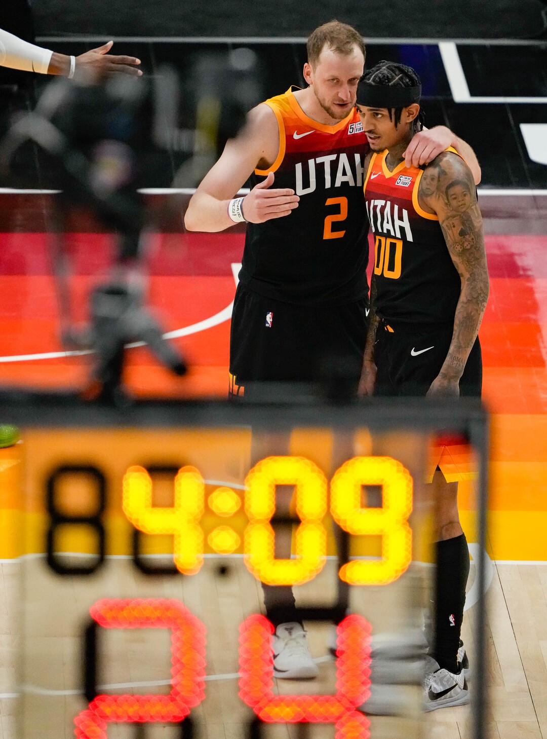 (Francisco Kjolseth | The Salt Lake Tribune) Utah Jazz guard Joe Ingles (2) and Utah Jazz guard Jordan Clarkson (00) talk on the court in NBA action between the Utah Jazz and the Portland Trail Blazers, at Vivint Smart Home Arena, on Wednesday, May 12, 2021.