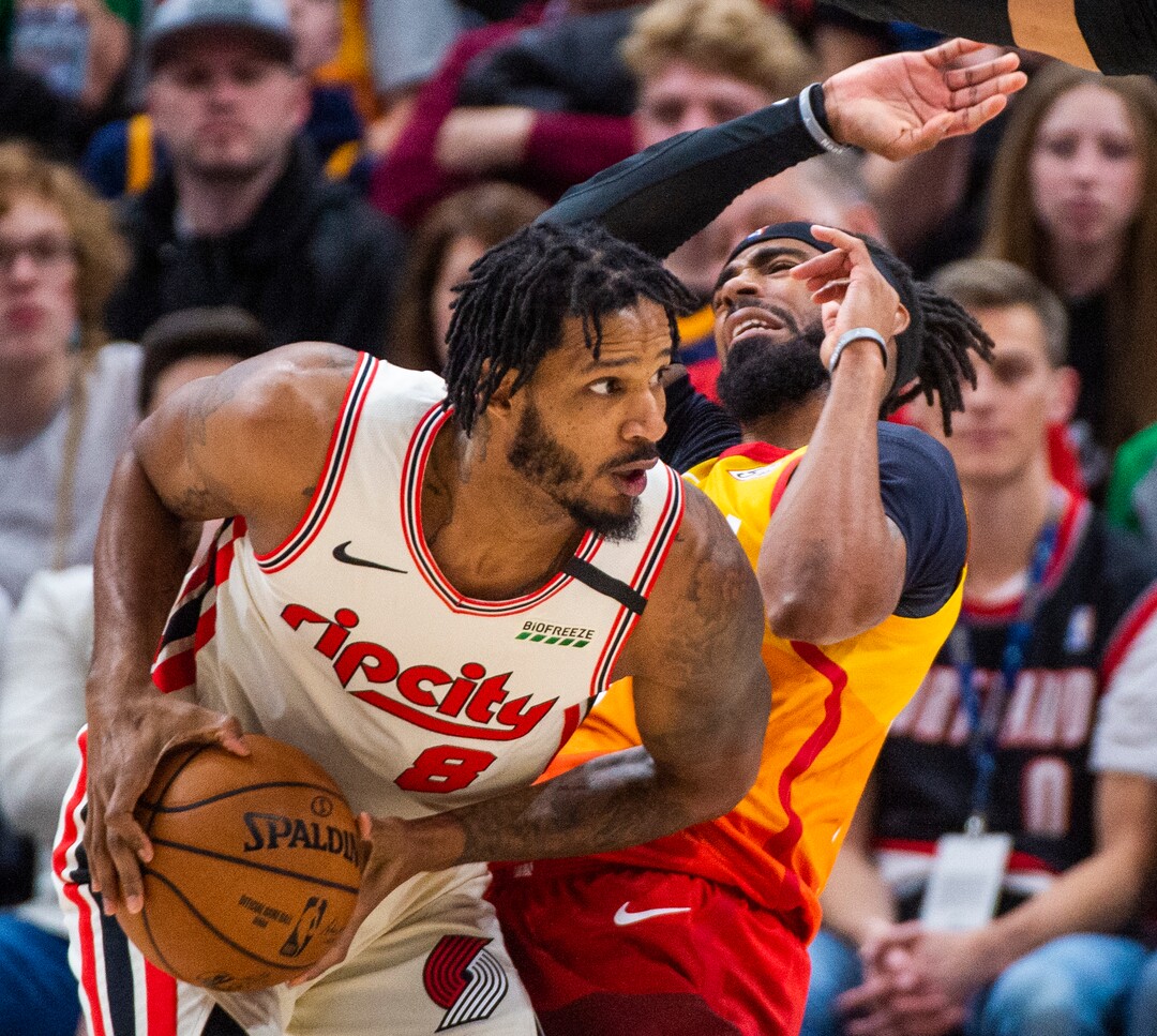 (Rick Egan  |  The Salt Lake Tribune)     Utah Jazz guard Mike Conley (10) gets bumped by Portland Trail Blazers forward Trevor Ariza (8), in NBA action between the Utah Jazz and thePortland Trail Blazers in Salt Lake City, Friday, Feb. 7, 2020.