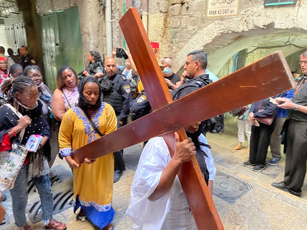 (Michael Stack | Special to The Tribune)
Christians follow the path Friday, April 15, 2022, on East Jerusalem's Via Dolorosa, which they believe Christ took as he was led to Golgotha to be crucified.