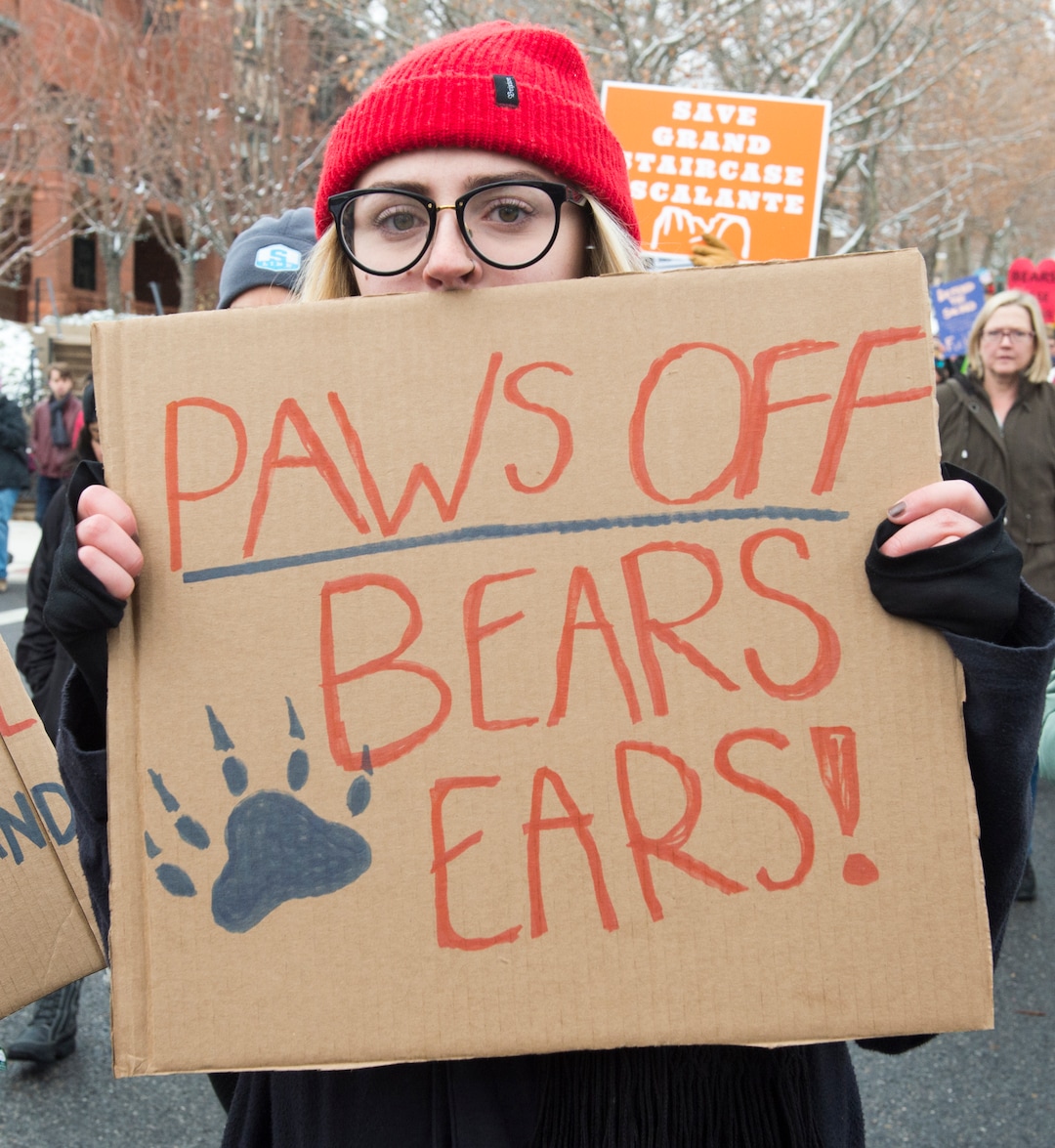 (Rick Egan  |  The Salt Lake Tribune)  Thousands of protesters turn their backs and march down State, as President Trump speaks at the Utah State Capitol, during his visit to Salt Lake CIty, Monday, December 4, 2017.