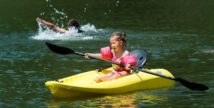 (Rick Egan  |  The Salt Lake Tribune)   Cate Camilo paddles around Farmington Pond, in a kayak, as they float on Farmington Pond, Thursday, July 26, 2018.