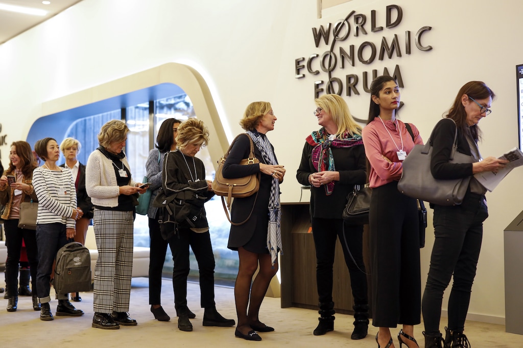 (Jason Alden  |  Bloomberg)  Female attendees line up for a panel session at the World Economic Forum in Davos, Switzerland, on Jan. 23, 2019.