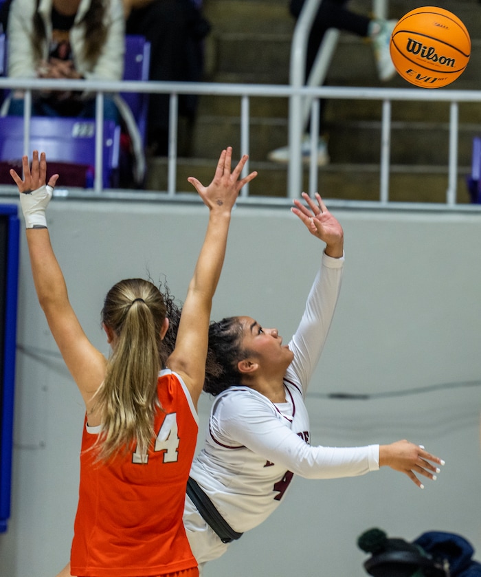 (Rick Egan | The Salt Lake Tribune) Makeili Ika (4) shoots for Lone Peak as Donya Perkins (14) defends for the Falcons, in the 6A girls Championship Game between Skyridge and Lone Peak, at Weber State, on Saturday, March 4, 2023.
