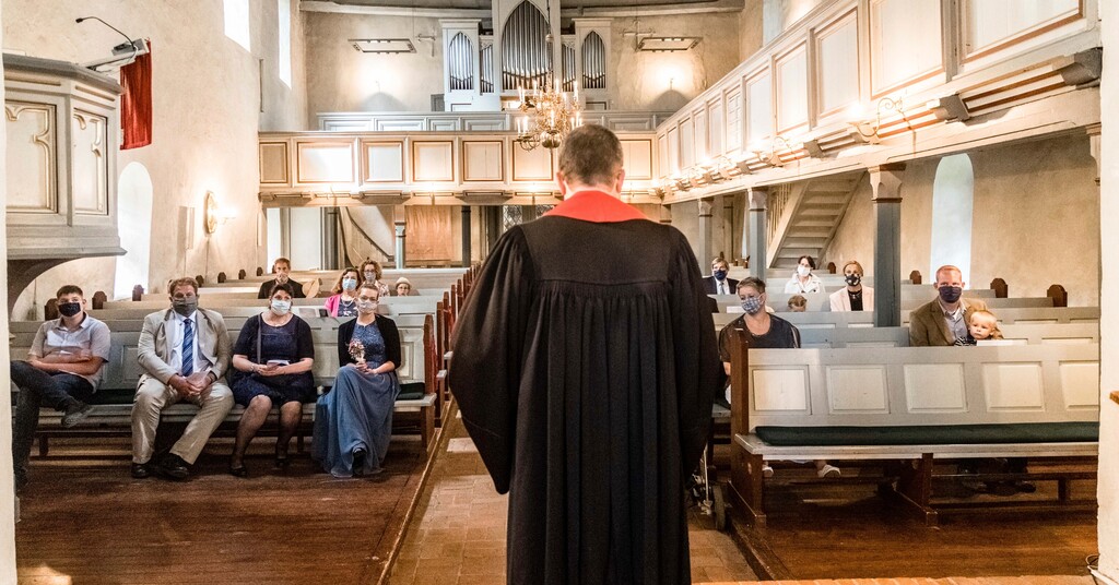 (Markus Scholz/dpa/dpa via AP) Priest Matthias Hieber celebrates a confirmation service according to the Corona protection measures in the church in Suesel, Germany, Sunday, July 12, 2020.