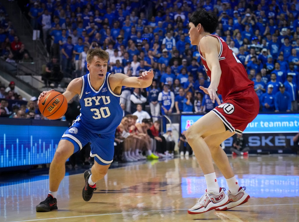 (Bethany Baker | The Salt Lake Tribune) Brigham Young Cougars guard Dallin Hall (30) drives to the basket as Utah Utes guard Mike Sharavjamts (25) defends during the game between the Brigham Young Cougars and the Utah Utes in Provo on Saturday, March 8, 2025.