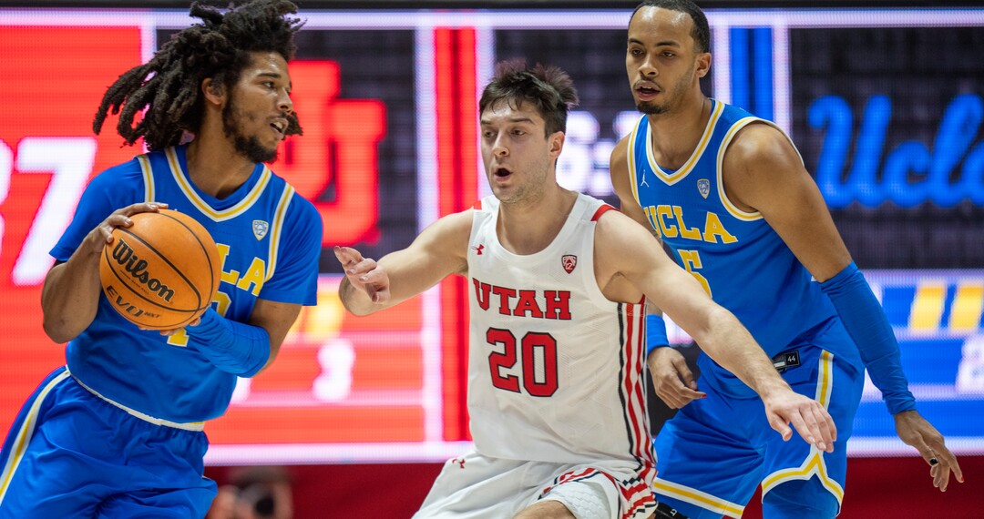 (Rick Egan | The Salt Lake Tribune) Utah Utes guard Lazar Stefanovic (20) guards UCLA Bruins guard Tyger Campbell (10), in PAC-12 basketball action between Utah Utes and UCLA Bruins, at the Jon M. Huntsman Center, Thursday, February. 23, 2022.