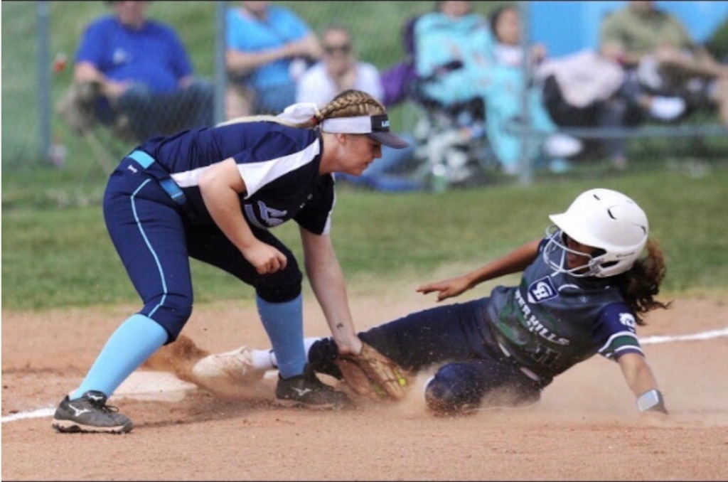 (Photo courtesy of Makaiya Gomez) Makaiya Gomez, right, slides into a base while playing for the Copper Hills High Grizzlies. Gomez, who will play for the University of Utah in the fall, won the Gatorade Utah Softball Player of the Year award.